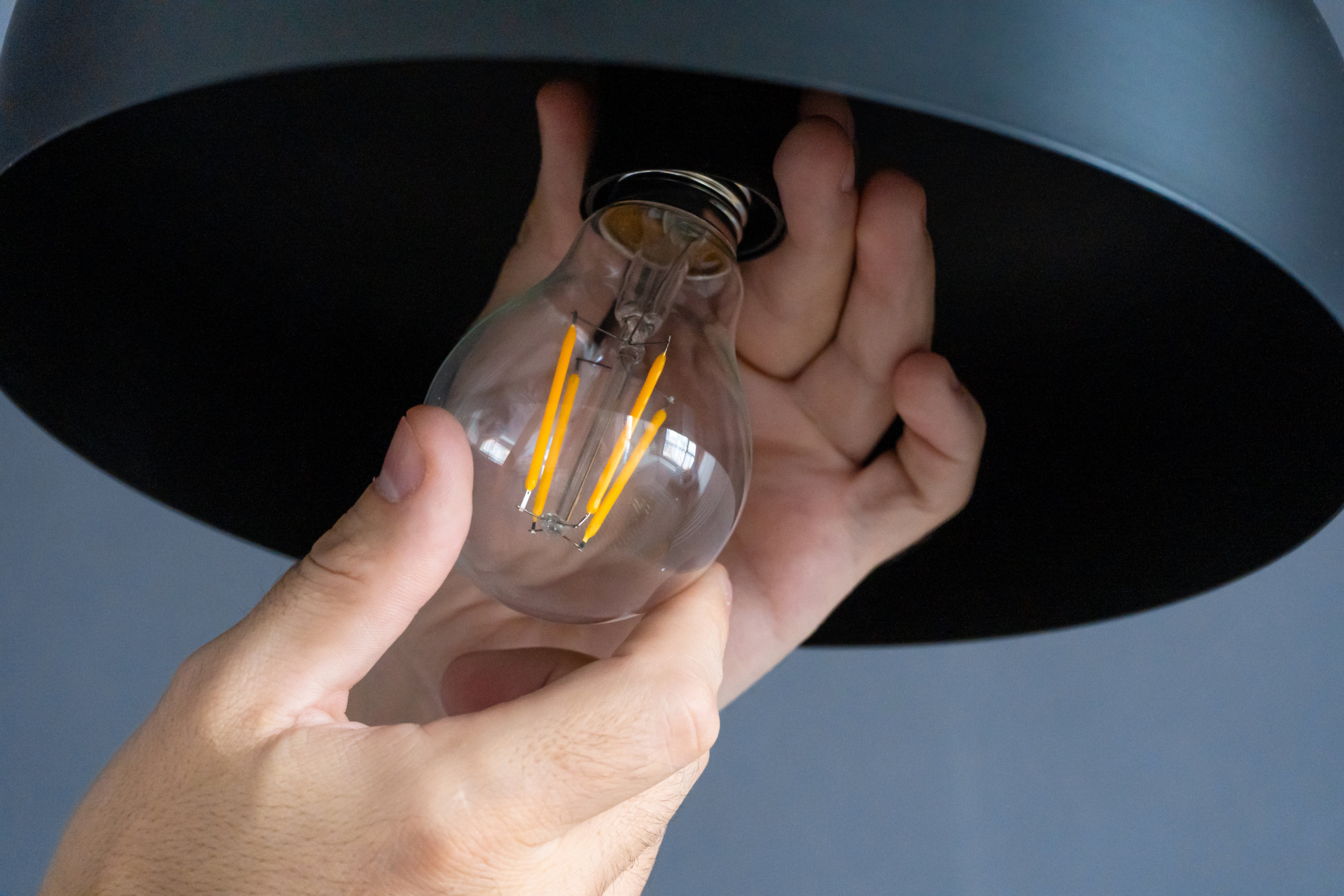 changing lightbulb in fixture